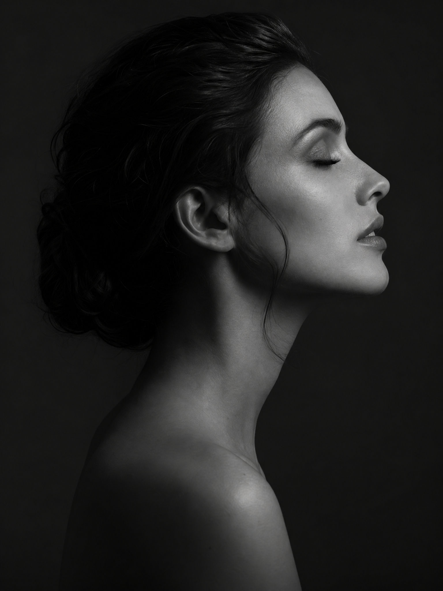Calm woman in soft profile — editorial monochrome